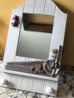 Mirror with hooks