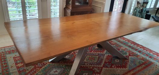 Solid wood dining table sits 10
