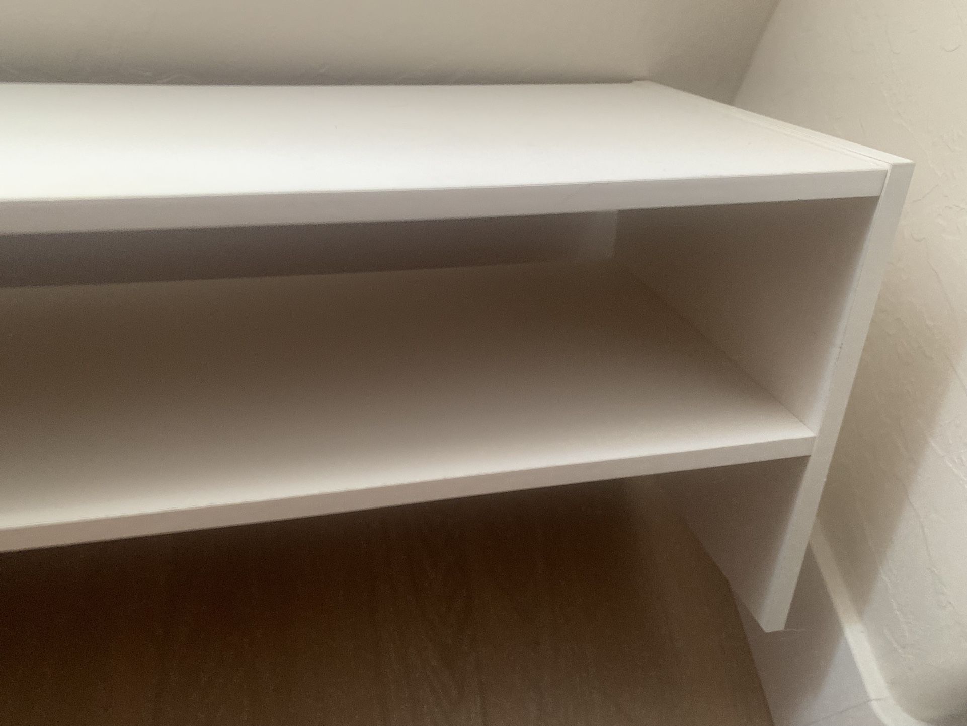 Short white shelf for books or shoes or display items