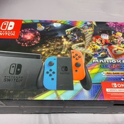 nintendo switch with two games, its controller and charging center and a case for the game comes with an additional 512 mg chip for nintendo
