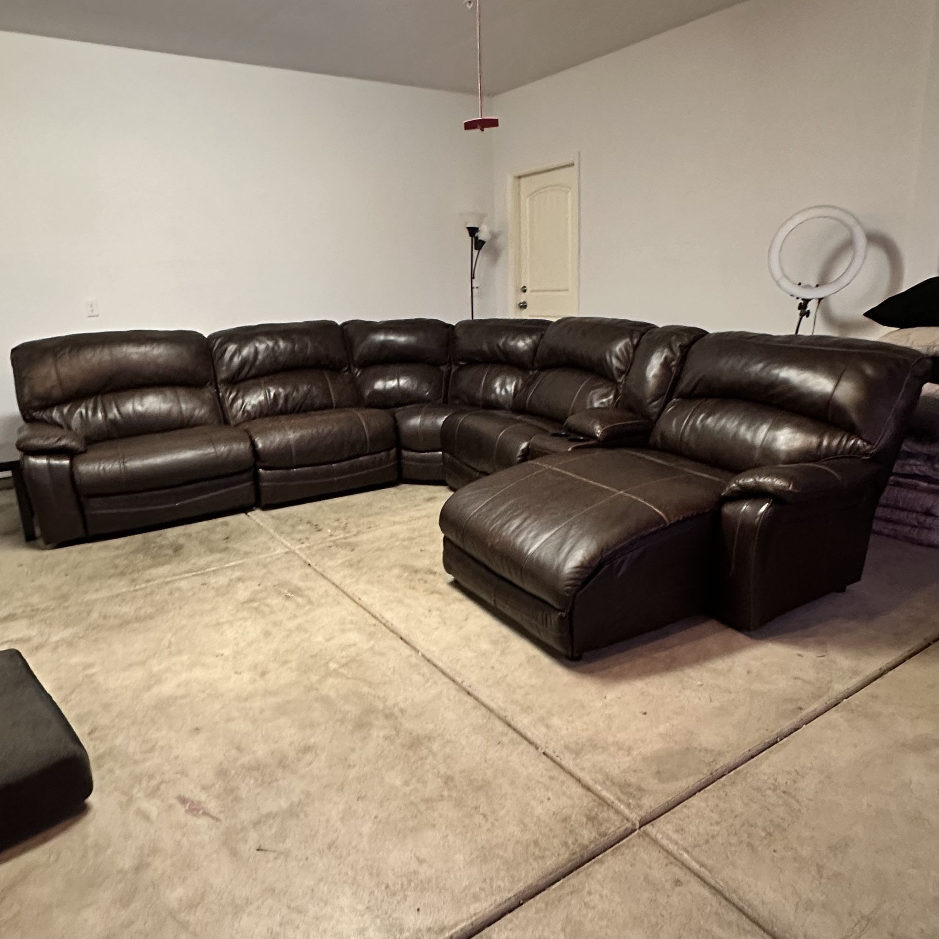 Ashley Furniture Damacio 6pc Powered Reclining Leather Sectional  The 3 recliners all work. Some slight wear and tear but overall great condition.  Di