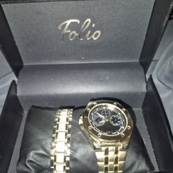 Gold And Black Watch And Bracelet 