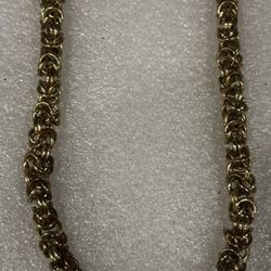 Heavy golden color, metal necklace