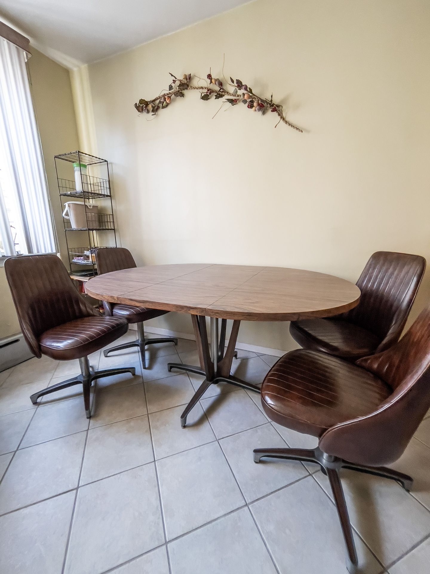 Mid-Century Modern Extendable Pedestal Table with Four Leather Swivel Chairs