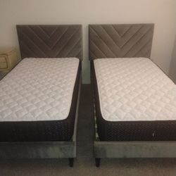 2 Twin beds with grey headboard