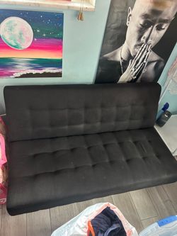 Amal black couch that turns into flat bed