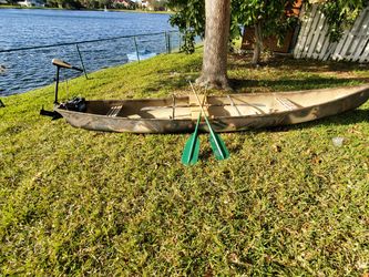 16' Indian River Canoe With Trolling Motor, Battery, And Extras
