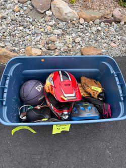 Rackets. Basketball. Baseball mitts. Riding helmet.