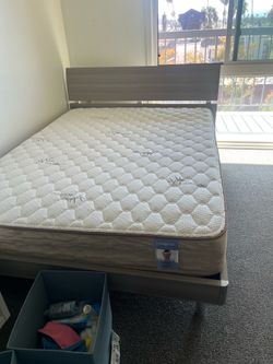 Wooden bed frame with New Mattress , also white cabinet drawer, and  wooden living room tv table