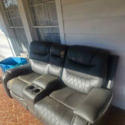 Black recliner sofa with cupholders
