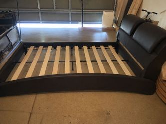 Black leather full size bed includes mattress and boxspring