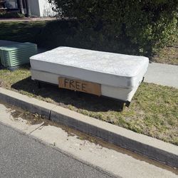 Free Twin mattress and boxspring with metal frame at the curb!