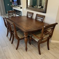Ashley walnut tone, dinning room table.