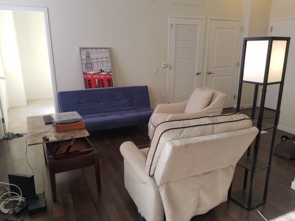 Move out sale, all for $150.00( 2) recliners in good conditions, one blue futon in good conditions, a folding coffe table good condition, one artwork