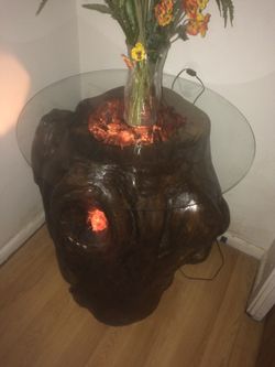 For sale hallowed out pecan stump table. Edison light with glass top. One of a kind very unique
