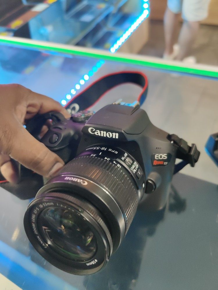 Canon EOS Rebel T7 DSLR Camera with 18-55mm lens, 2 Battery& Charger, Camera Strip.