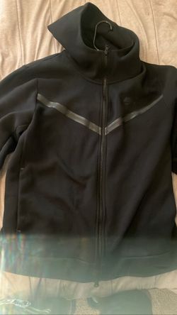 Black Nike Tech hoodie.