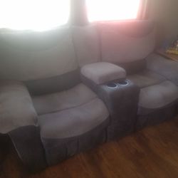 Electric reclining sofa with consol and matching single recliner