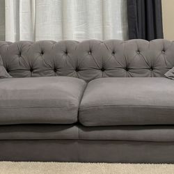 85 Inch Upholstered Grey Linen Chesterfield Tufted Sofa And Two Matching Solid Grey Throw Pillows With Inserts (Wayfair)