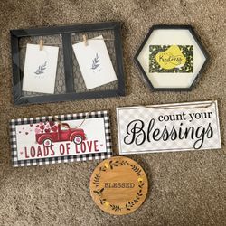 Assortment of signs, picture frame and wooden trivet