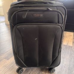 American Tourister 22 Inch Rolling Soft Shell Suitcase( Used 1 Time )
