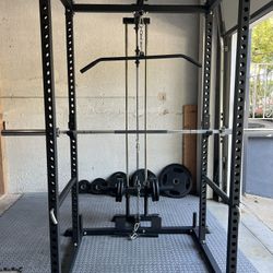 Brand New Titan T2 power rack w lat pulldown attachment, Olympic barbell and grip plates