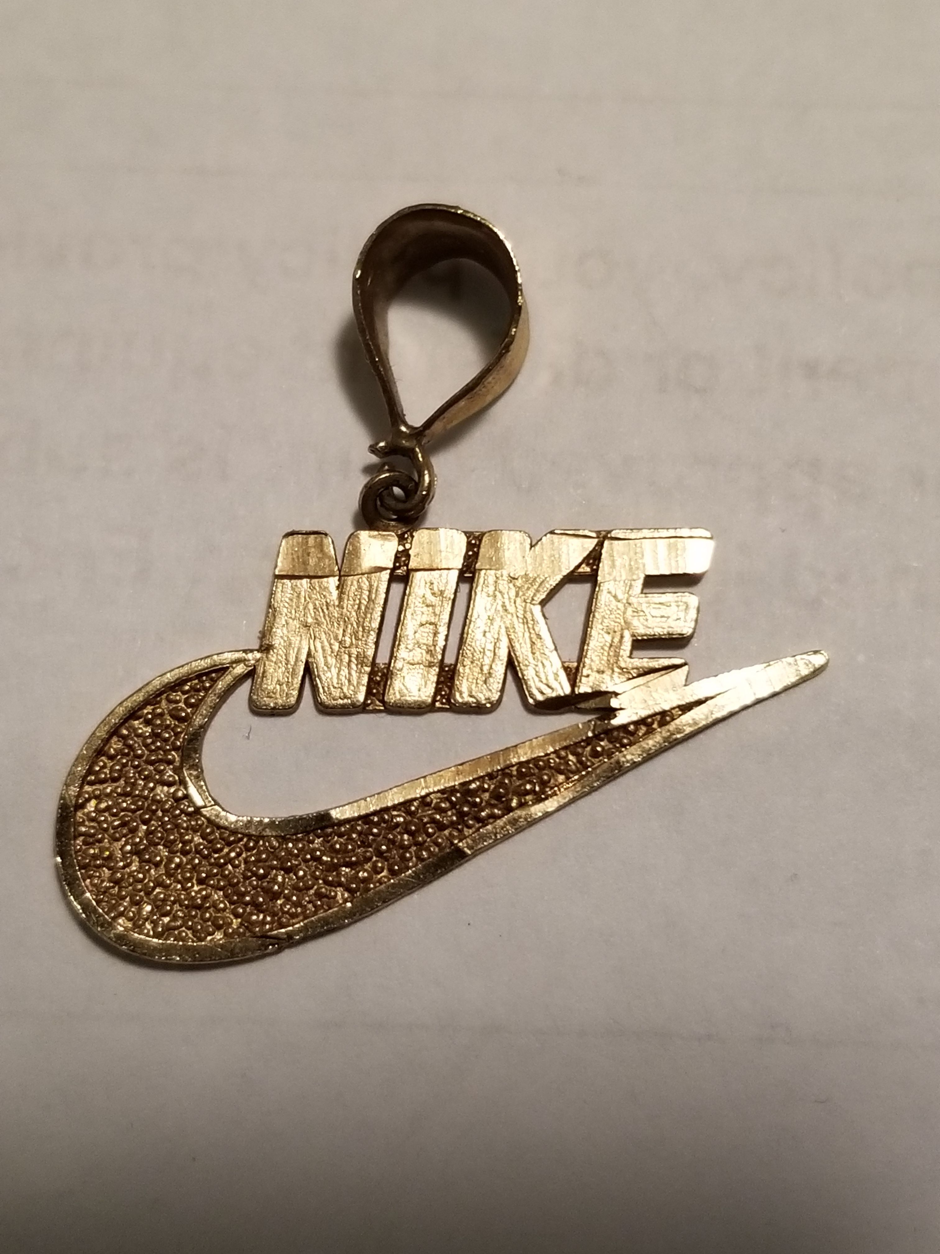 NIKE. Gold Swoosh Pendant Necklace in 2023