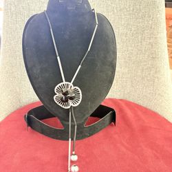 Never Use Silver Like and Black Tube with Leather and Flower Shape Pendant