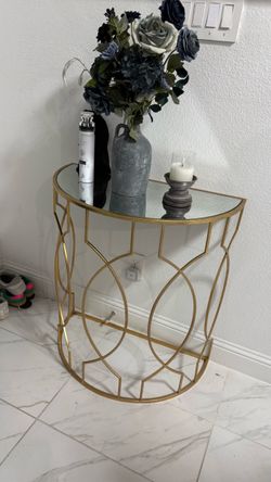 . Gold Half-Moon Mirrored Console Table — $95