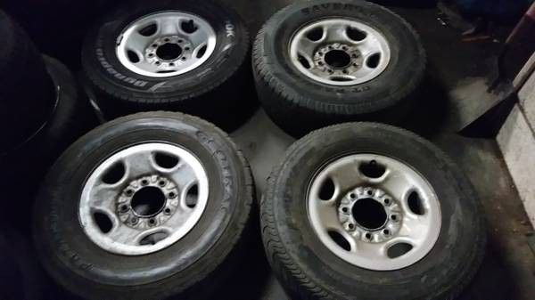 set of four 8 lug Chevy/GMC 16 inch 2500HD steel rims and tires