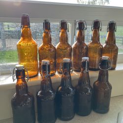 Eleven (11) Flip Top Beer, Kalua, Soda Bottles. Those Comparisons Are From a local  store  for a dozen bottles  new. 