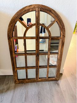 Arched wall mirror with wood window frame