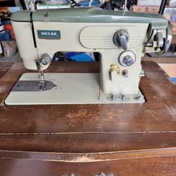 Vintage Sewing Machine And Cabinet