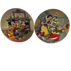 limited edition collector's plate from 1987 called "Snow White's Surprise". And Mistletoe Magic" Christmas plate from 1986, featuring Mickey Mouse and