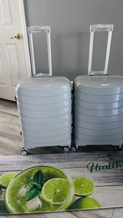 BRAND NEW Set of 2 Gray Hardshell Spinner Suitcases β TSA Lock β $40 FOR BOTH near IKEA (S. Durango & 215), Brand new set of TWO matching light gra