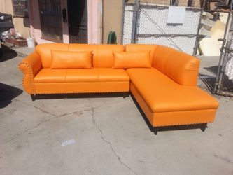BRAND NEW 9X7FT AND 7X9FT SECTIONAL CHAISE, ORANGE LEATHER. CUSTOM MADE AVAILABLE