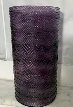 Elegant cylindrical glass vase featuring a rich purple or amethyst hue with a pressed geometric chevron and triangle pattern.