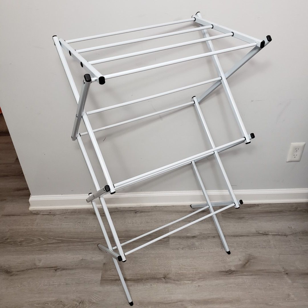 Compact foldable drying rack in pale grey / blue.