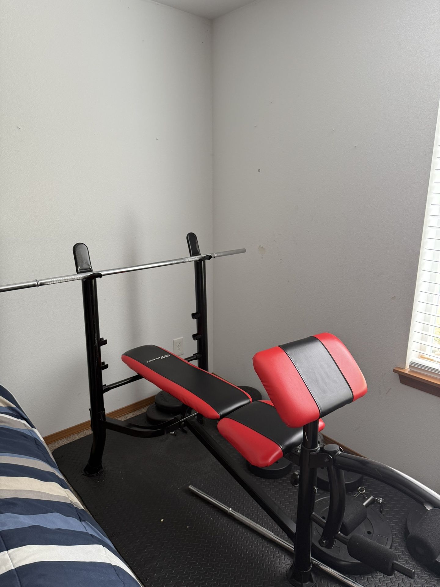 Weight Bench with Two Bars with Weights, Including A Singular 25lb Dumbbell.