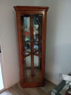 Curio cabinet, corner. Maple color. Solid wood.