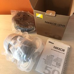 Lens is in like new condition.  Includes hood, both caps, original manual, and soft storage pouch.  All in original box and packing  Cash only, pick u