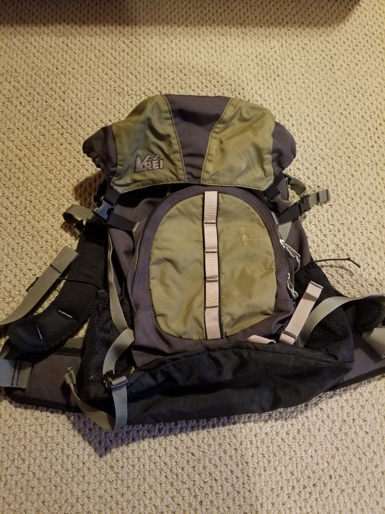 REI Multi-pocket green backpack