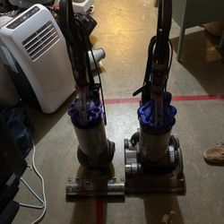 Two Dyson Vaccums 