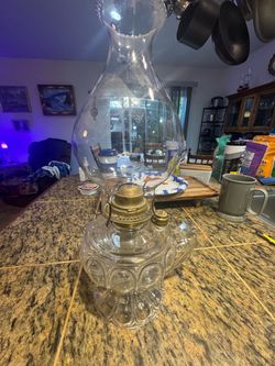 Antique oil lamp w a handle on the base