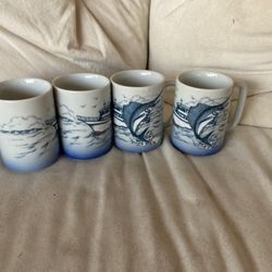 Brand new never used boat on the ocean with a selfish Set of mugs