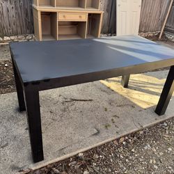 Black Table 30 inches wide by 60 inches long by 30 inches high.