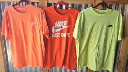 Set of three Nike short-sleeve crewneck t-shirts in orange and lime green colors.
Sizes XL 
$30.00 for all three 
No rips or stains 
Super clean 
Low 