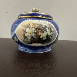 Beautiful vintage Limoges France porcelain music box, hand-painted in deep cobalt blue with a lovely floral basket motif.     •    Made in Limoges, Fr