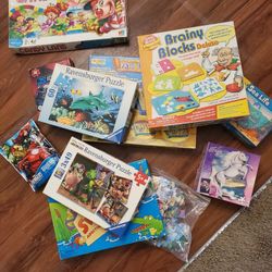 Assorted Board Games And Jigsaw Puzzles