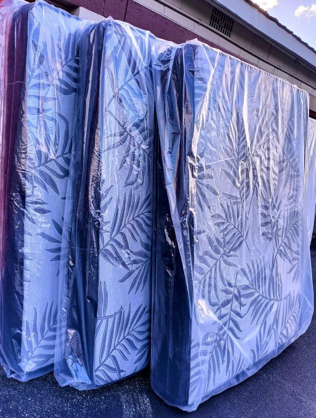 New Queen Size Mattress. Factory Sealed!!